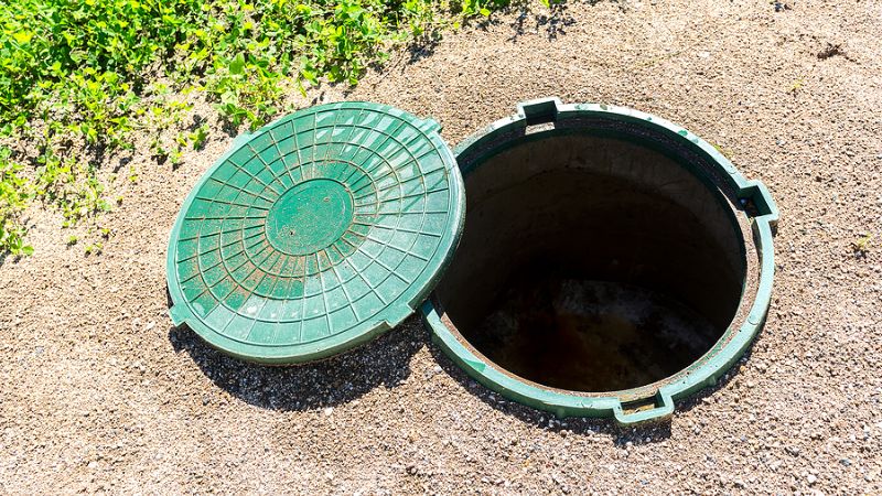 septic tank riser and lid installation